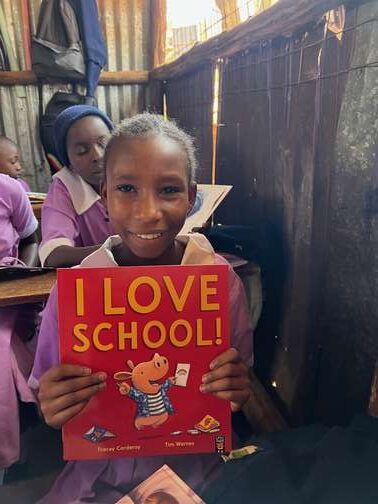 Ubuntu Africa, school, Kenyan student with book