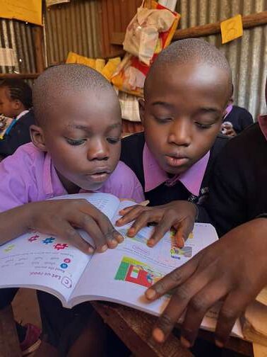 Ubuntu Africa, education resources, Kenyan children with school book